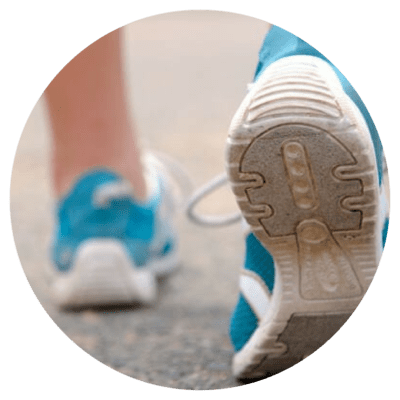 Person walking in trainers on road